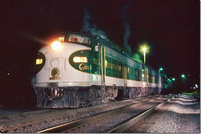 Southern Ry E-8a 6913 on 2nd No. 2, the northbound Southern Crescent in the cold early morning hours of Dec. 27, 1977. It was running in two sections because of heavy post Christmas ridership. Lynchburg VA.